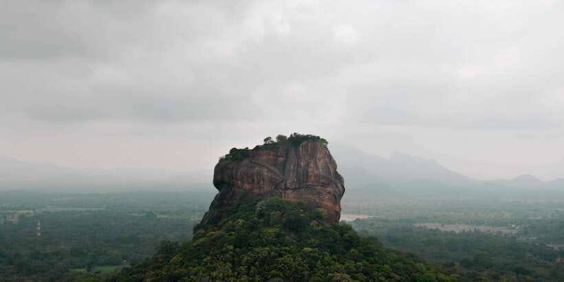 From Colombo: Sigiriya and Dambulla Full-Day Private Tour - Sigiriya Rock Fortress: The Lion Gate and the Steep Climb